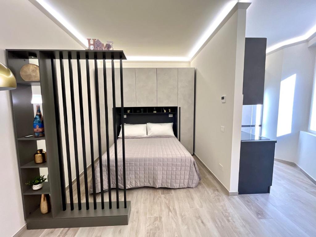 a bedroom with a bed with a black rail at Garibaldi Living - Centro Storico Parma in Parma