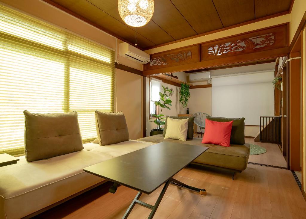a living room with a couch and a table at 笑福邸 in Shiogama