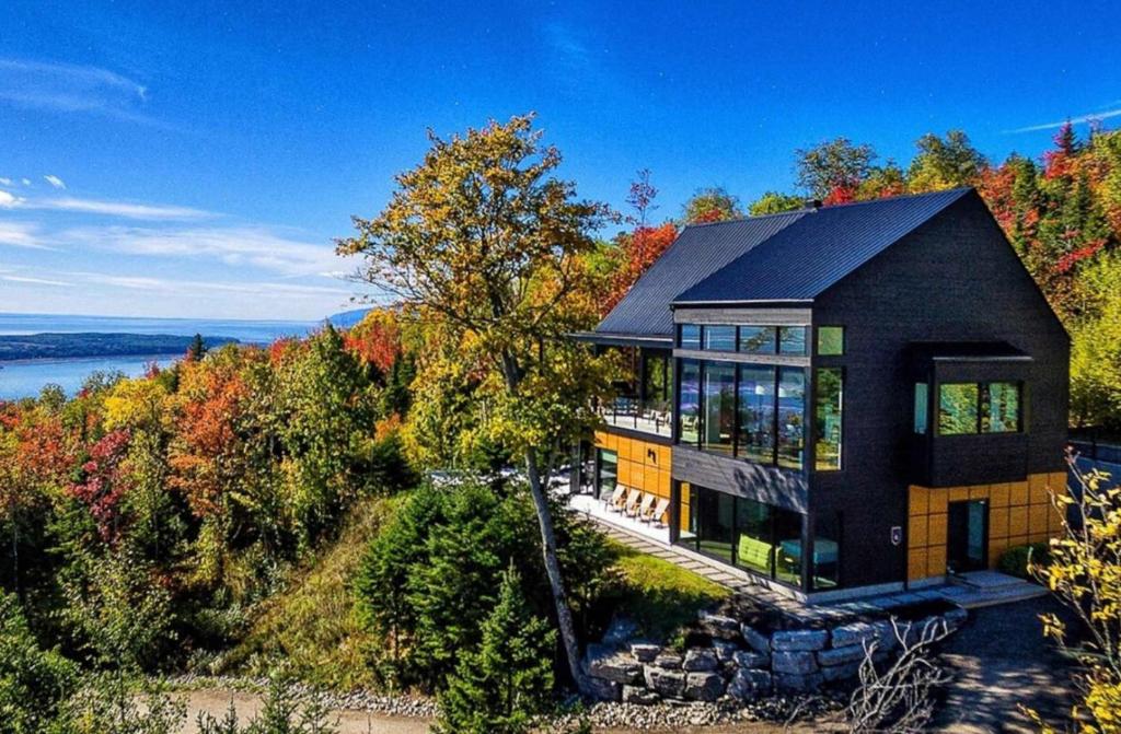 an aerial view of a house on a hill at Secret Charlevoix - River View & Spa in Les Éboulements