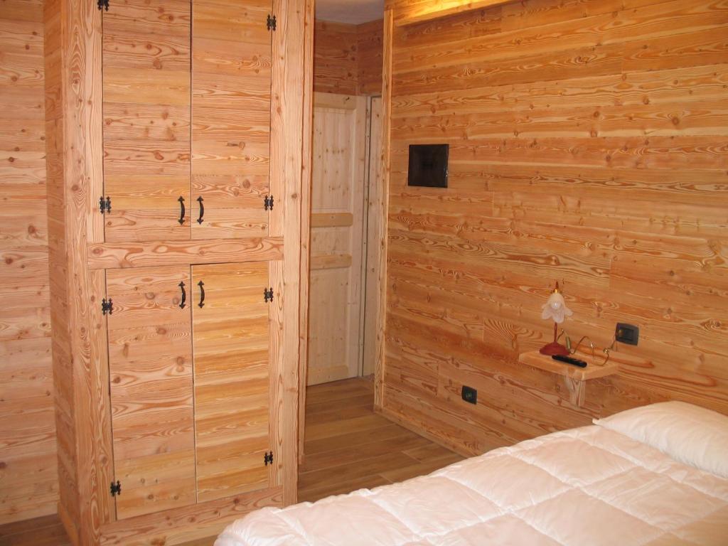 Letto o letti in una camera di B & B Le Riue