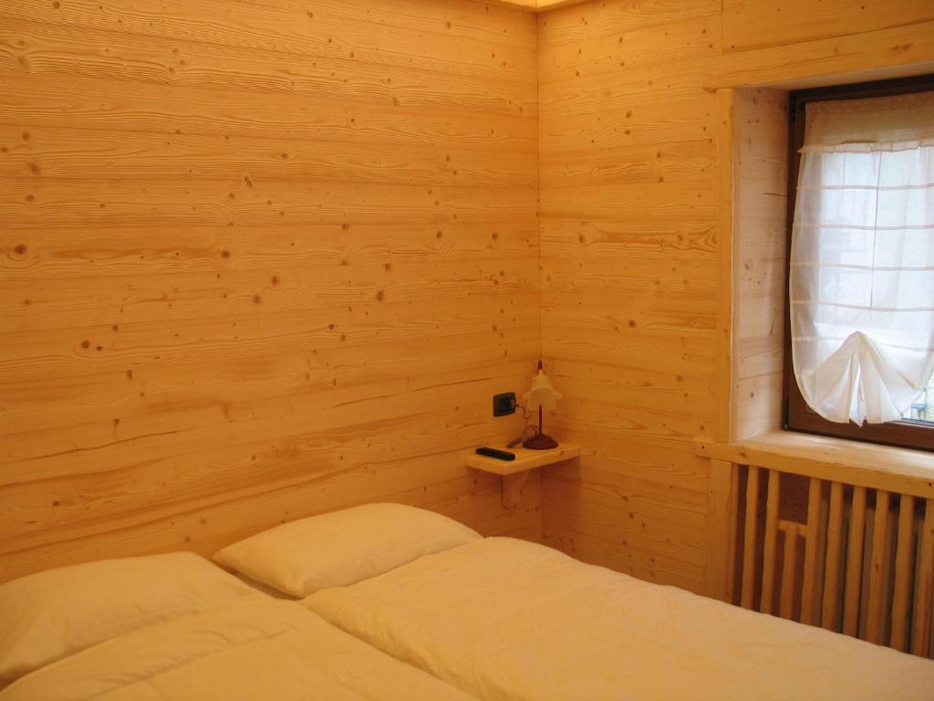 Letto o letti in una camera di B & B Le Riue