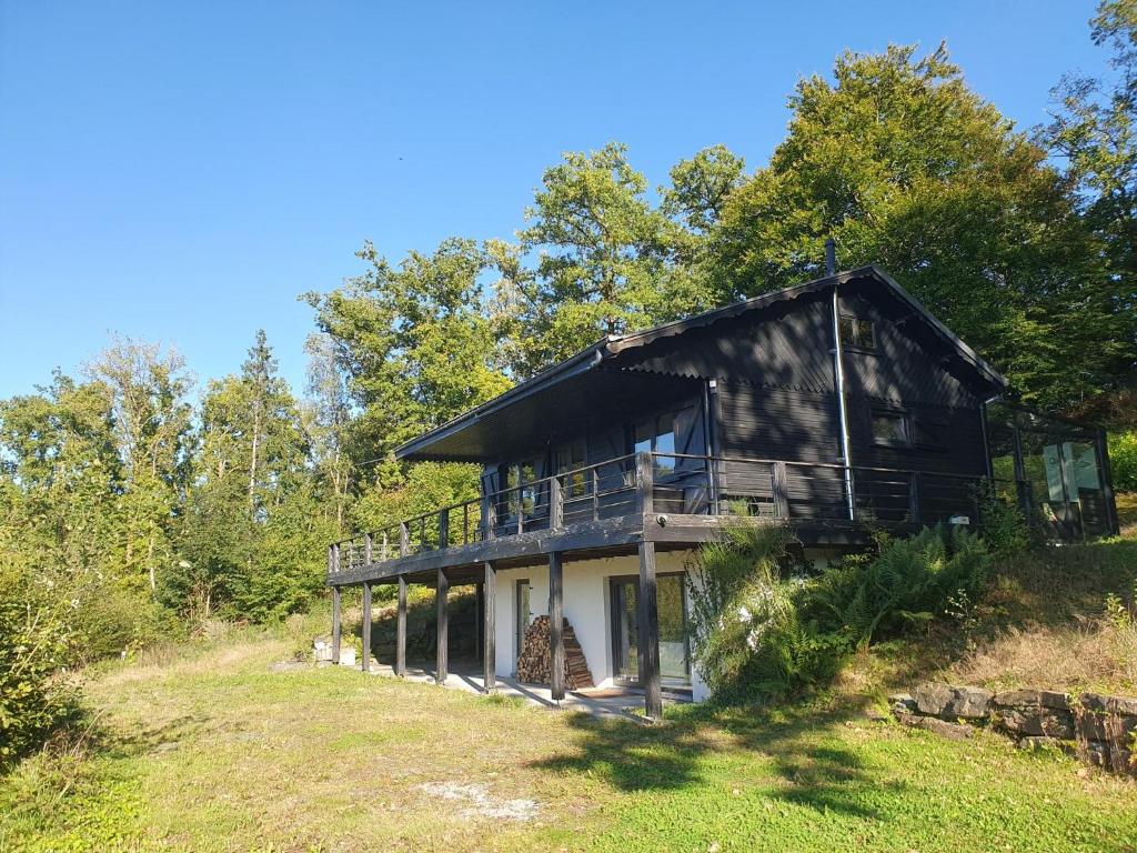 a house on the side of a hill at Agathe in Laforêt