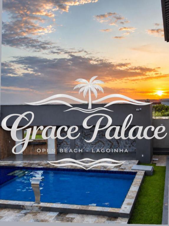 a sign for a dance palace on the beach of a resort at Grace Palace in Paraipaba