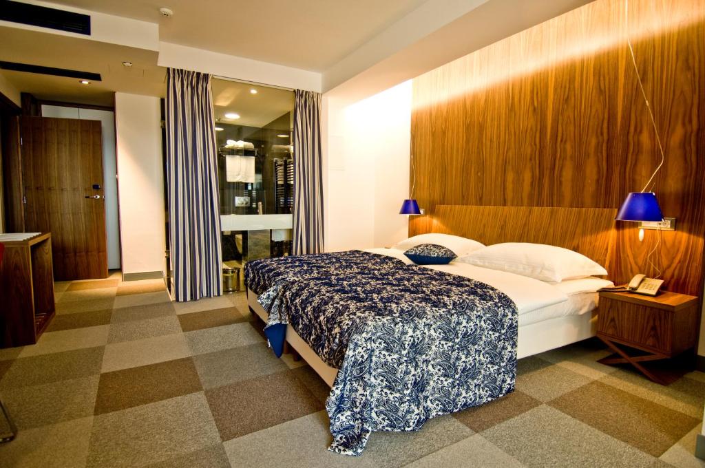 Postel nebo postele na pokoji v ubytování Hotel IN