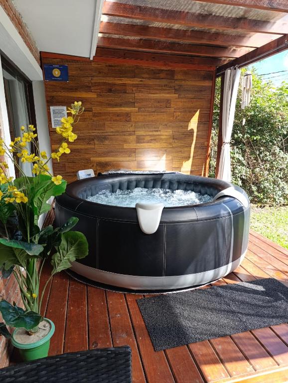 a large hot tub sitting on a deck at Villa Anita Spa in Piriápolis