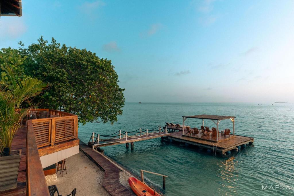 a dock in the middle of the water at Ecohotel Raices del Rosario in Cartagena de Indias