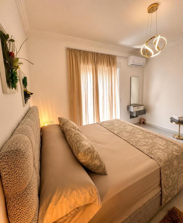 a bedroom with a large bed and a window at Modern Comfort Stay Tanger in Tangier