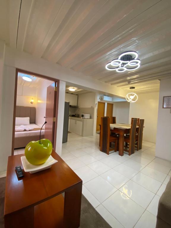 a living room with a table with a green bowl on it at The P Residences in San Agustin