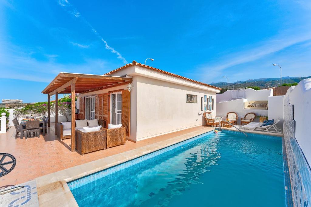 a villa with a swimming pool and a house at Ocean View 3bedroom Villa with pool in Callao Salvaje