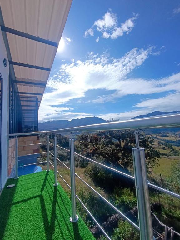a balcony with a view of the ocean at Hotel Páramo de Sumapaz in San Juan