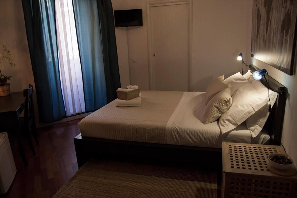 Łóżko lub łóżka w pokoju w obiekcie B&B Gallidoro