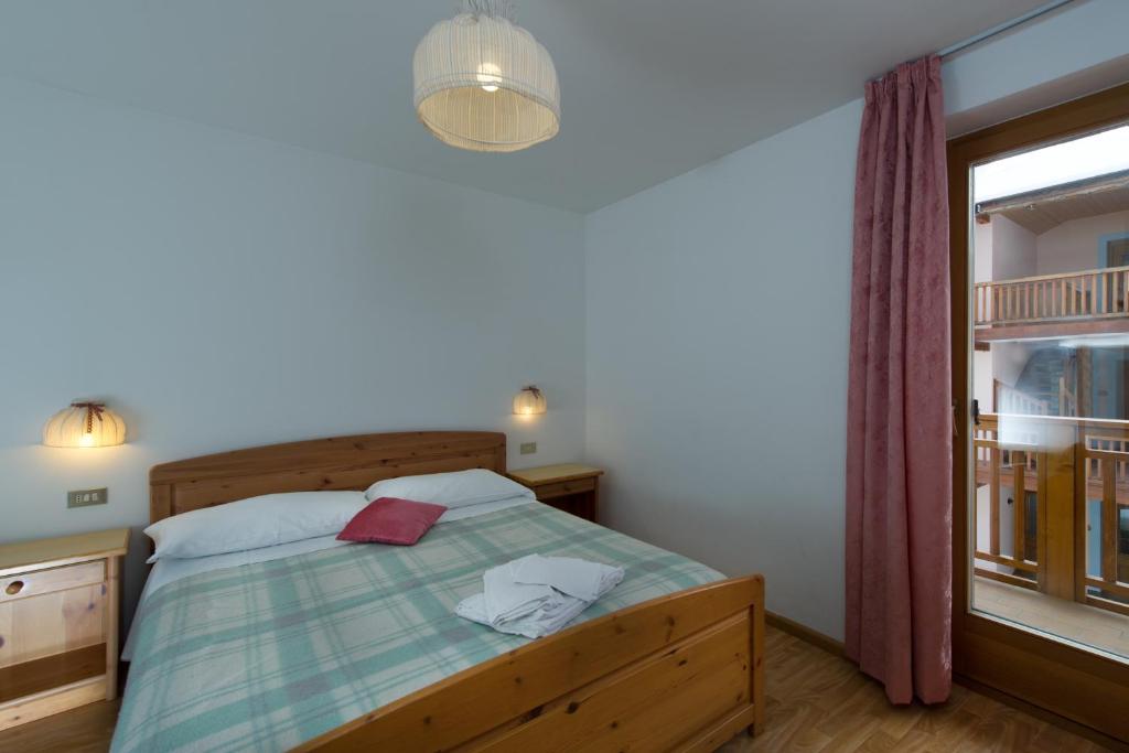 Łóżko lub łóżka w pokoju w obiekcie Residence Villa Boschetto
