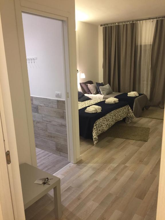 A bed or beds in a room at De Guestibus
