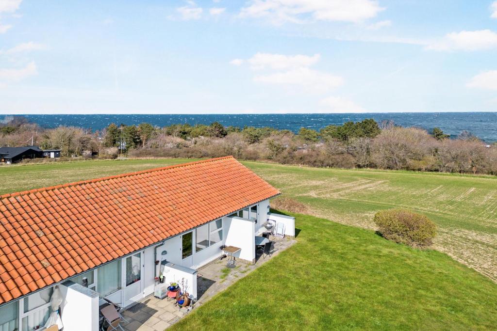 an aerial view of a house with an orange roof at Bornholm Holiday Apartment With Sea View in Allinge