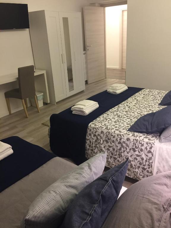 A bed or beds in a room at De Guestibus