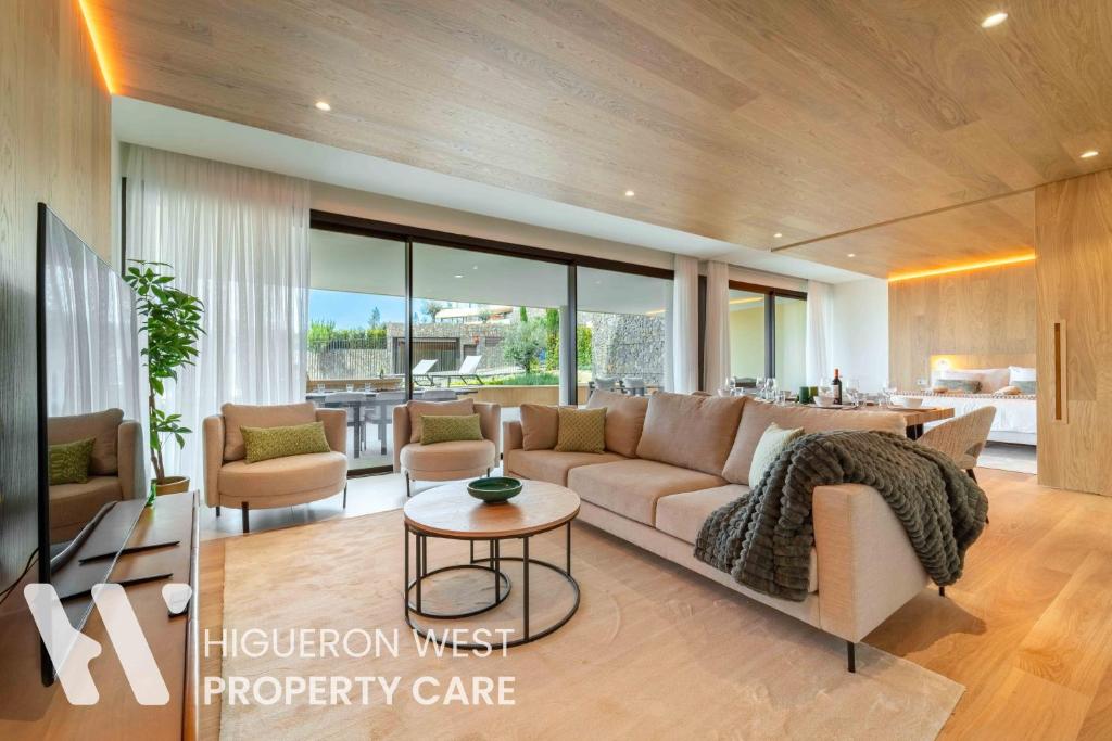 a living room with a couch and a table at The Horizon - Luxury 3-Bedroom with Private Plunge Pool and Terrace, South Residences, Higueron Resort, Fuengirola in Fuengirola