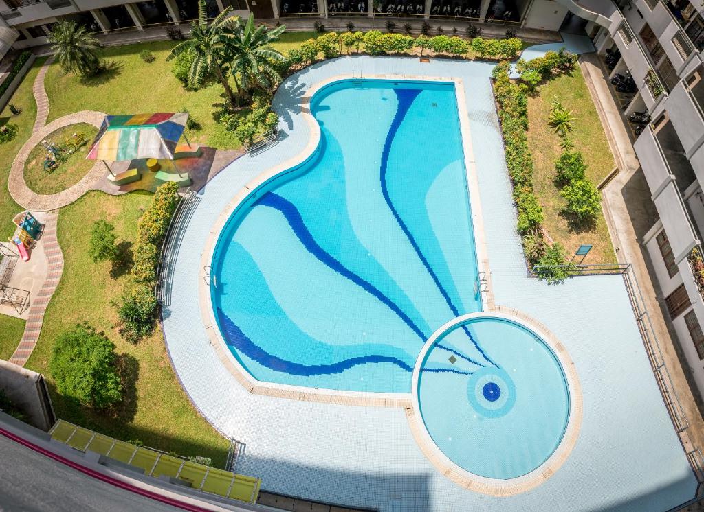 an overhead view of a large swimming pool at Eastern Apartment in Jelutong