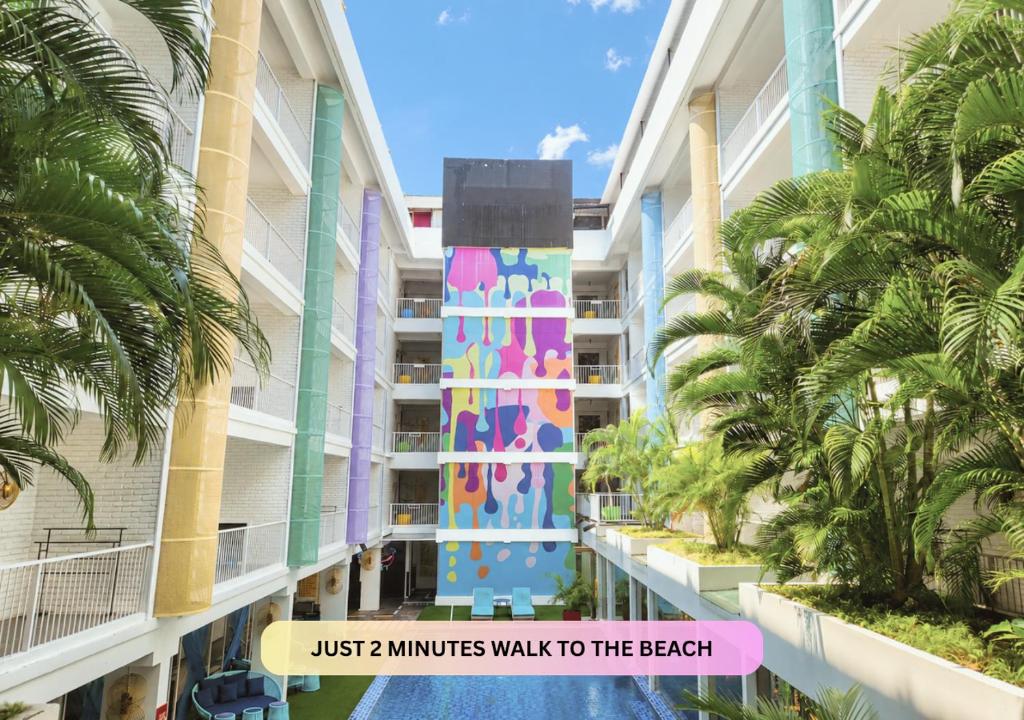 a building with a sign that reads just minutes walk to the beach at Viva Dash Hotel Seminyak in Seminyak