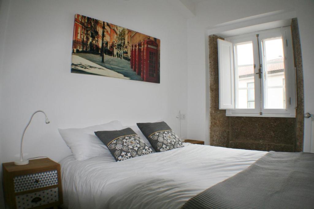 Cama o camas de una habitación en Apartamentos Pombal
