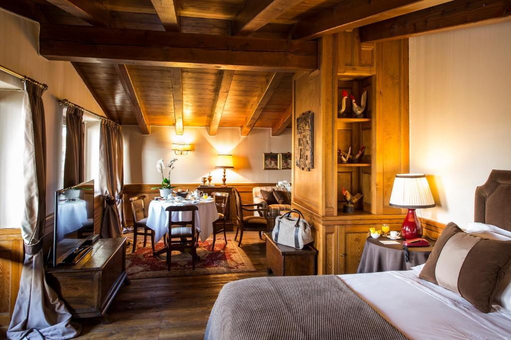 Posezení v ubytování Hotel Hermitage Relais & Châteaux