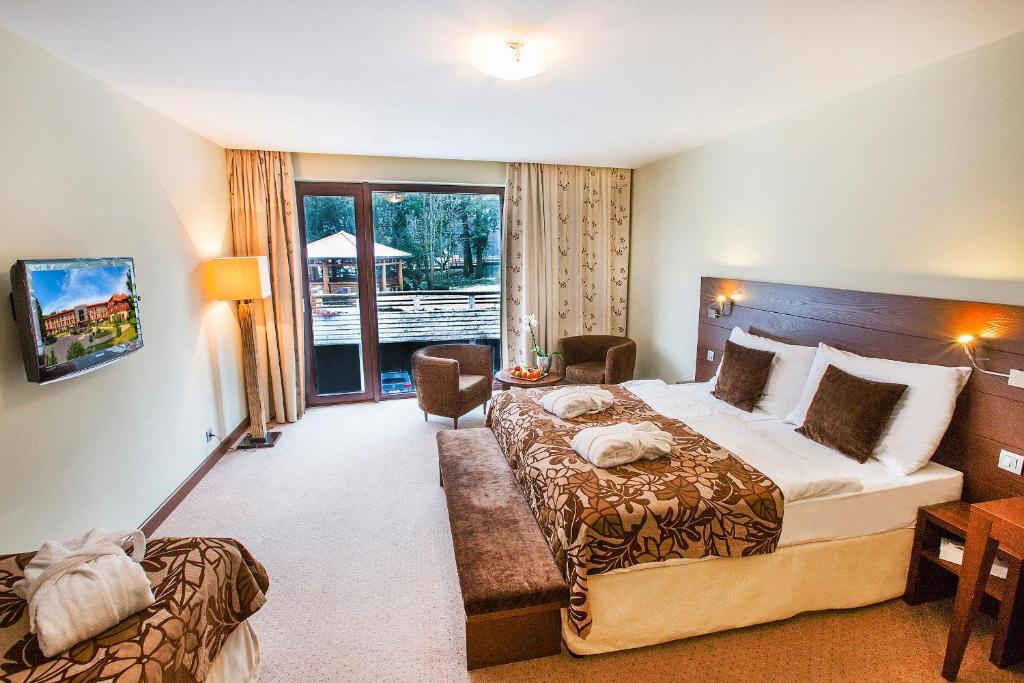 Postel nebo postele na pokoji v ubytování Hotel Zochova Chata - Adult friendly