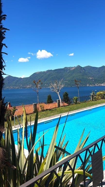 a swimming pool with a view of the water at Casa Sophie in Luino