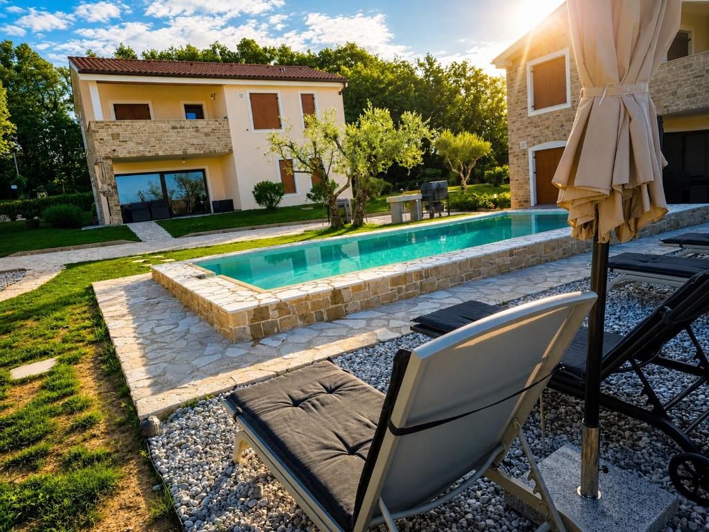 a swimming pool with a chair and an umbrella at Villa Nova Resort with pool in Sveti Peter