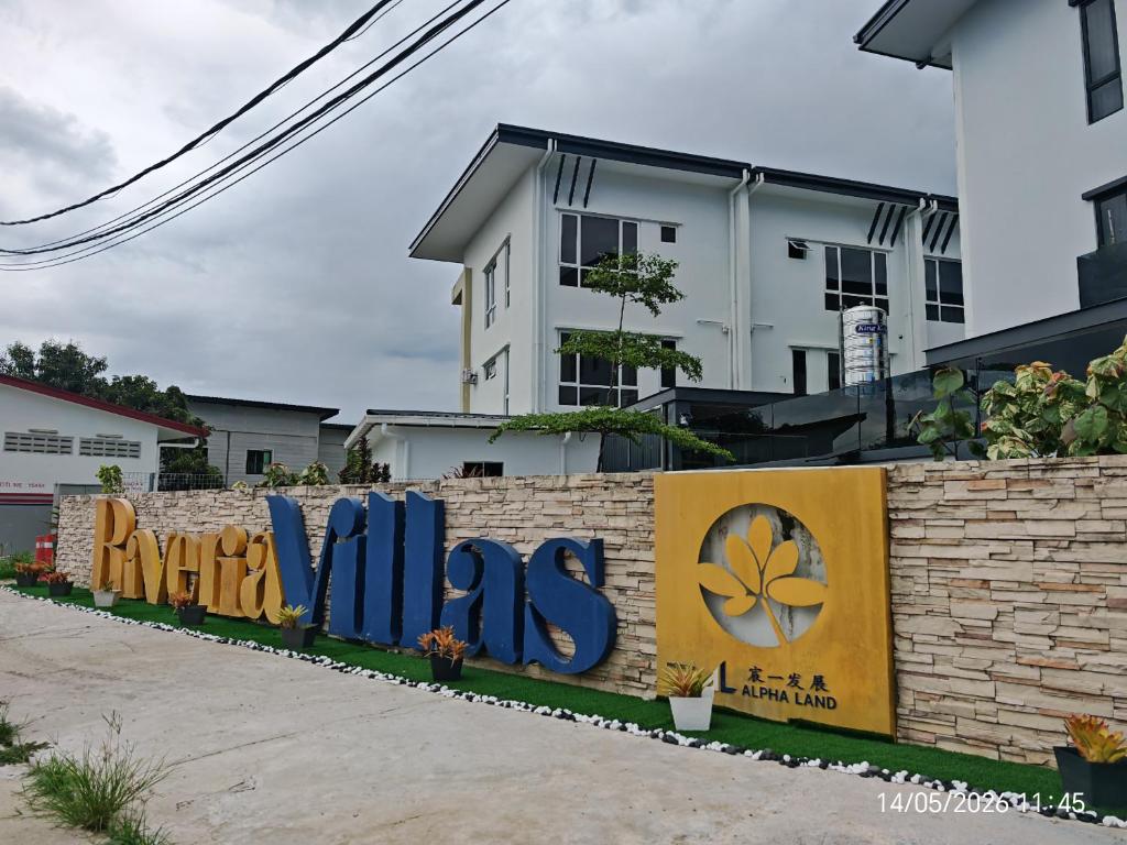 a brick wall with a sign that reads dyos at JN Villa Homestay 5 Bedroom house, Near Airport Kota Kinabalu in Donggongon