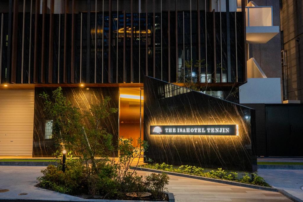 a building with a water fountain in front of it at The ISA Hotel Tenjin Fukuoka in Fukuoka