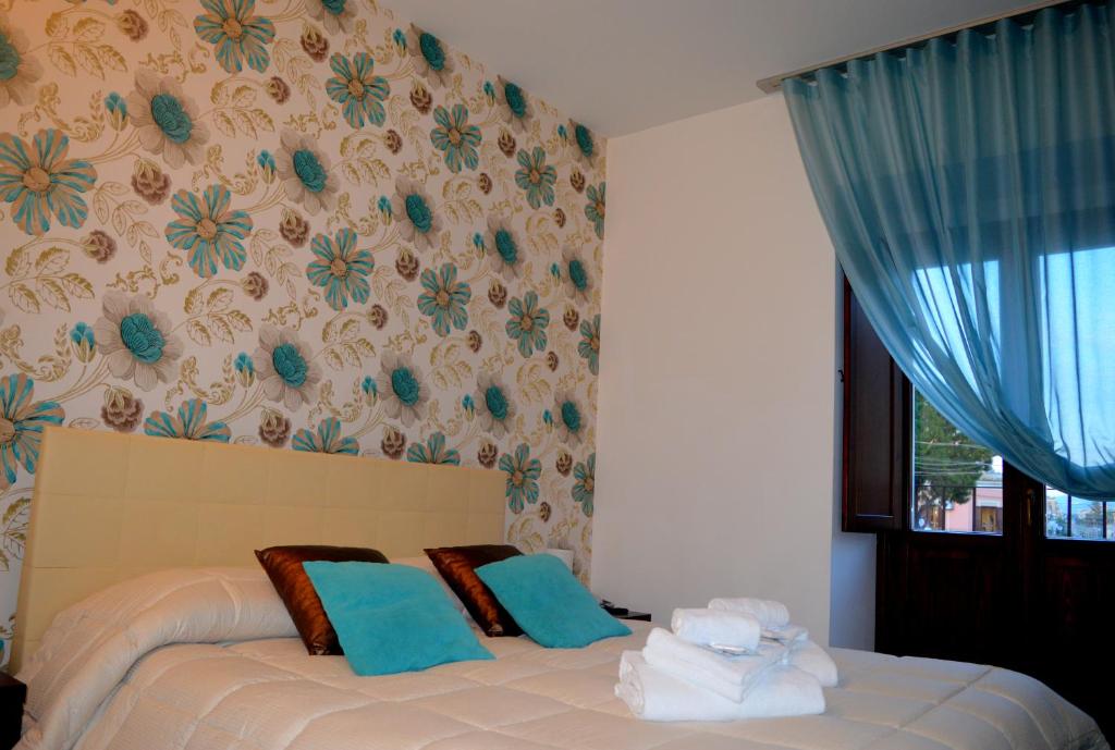 Postel nebo postele na pokoji v ubytování Abraxia B&B