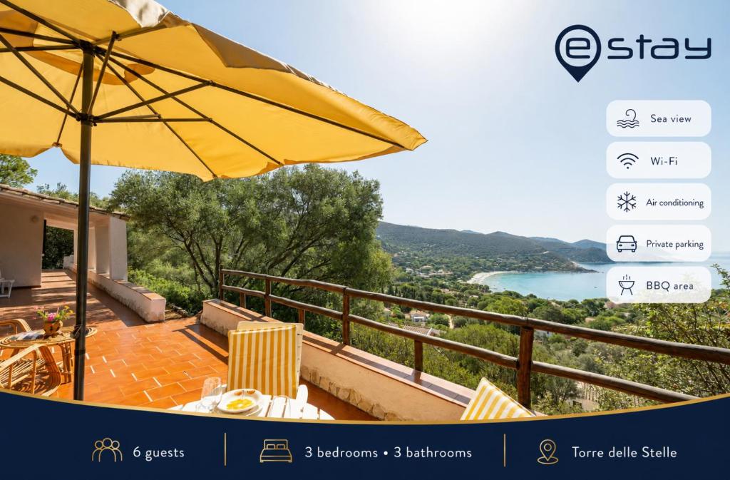 a patio with an umbrella and a view of a river at Estay - Seaside Gem Villa in Torre delle Stelle