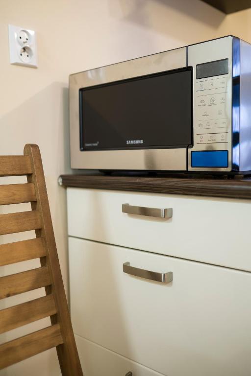Kuchyňa alebo kuchynka v ubytovaní Sentymentalne Kościelisko Apartament & SPA