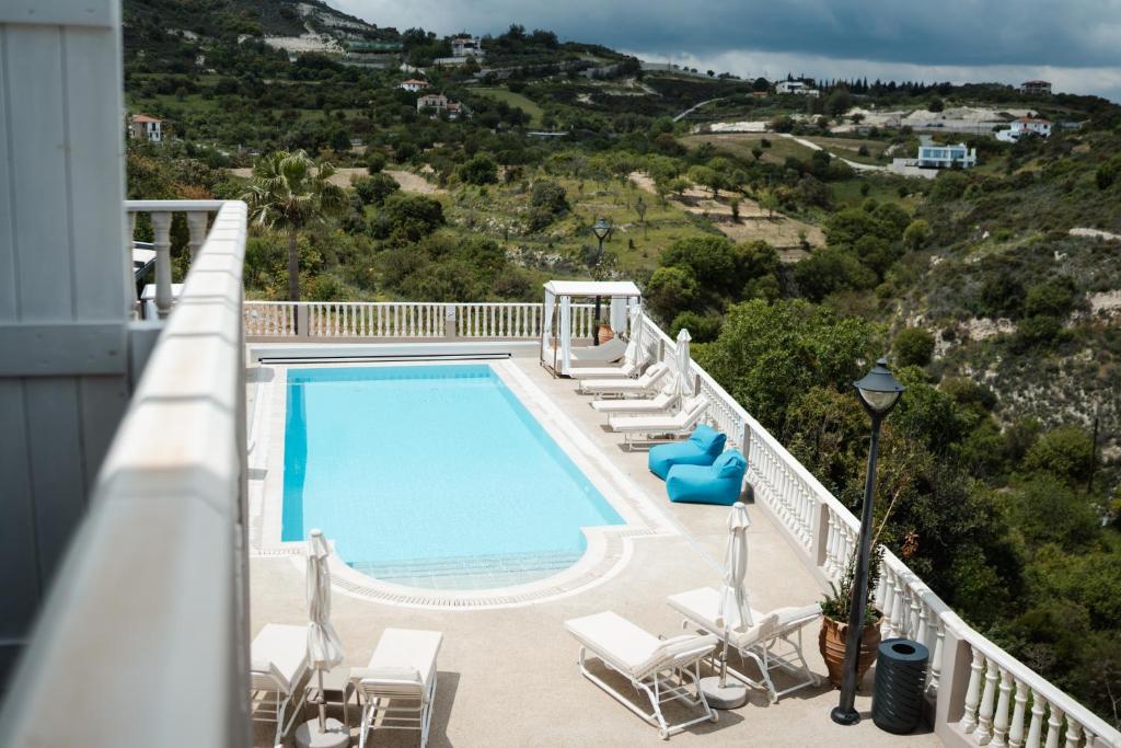 a swimming pool on the balcony of a house at Archontiko Kiverniti in Pano Lefkara