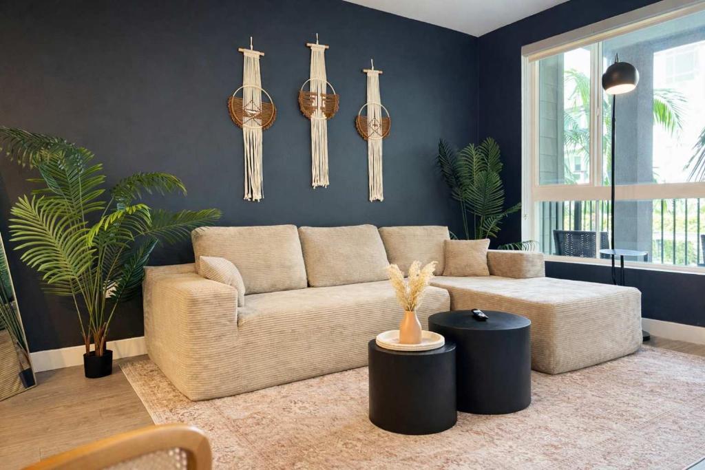 a living room with a couch and a table at Artistic Getaway 10 Min to Disneyland With Pool&GYM in Tustin