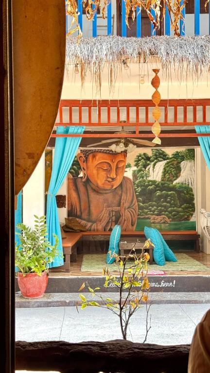 a wall with a painting of a man on it at LaZerena Lodge in Zambales