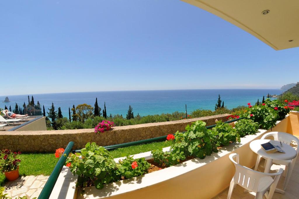 a balcony with a view of the ocean at Pelagos Agios Gordios in Agios Gordios