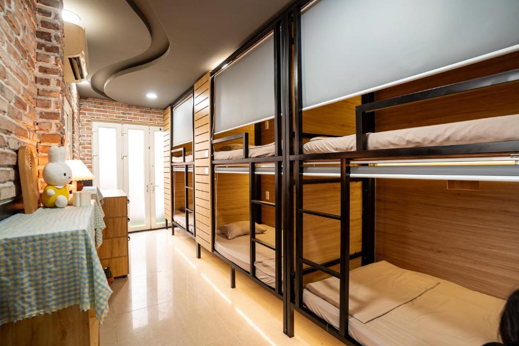 a group of bunk beds in a room at Saigon Box Hostel in Ho Chi Minh City
