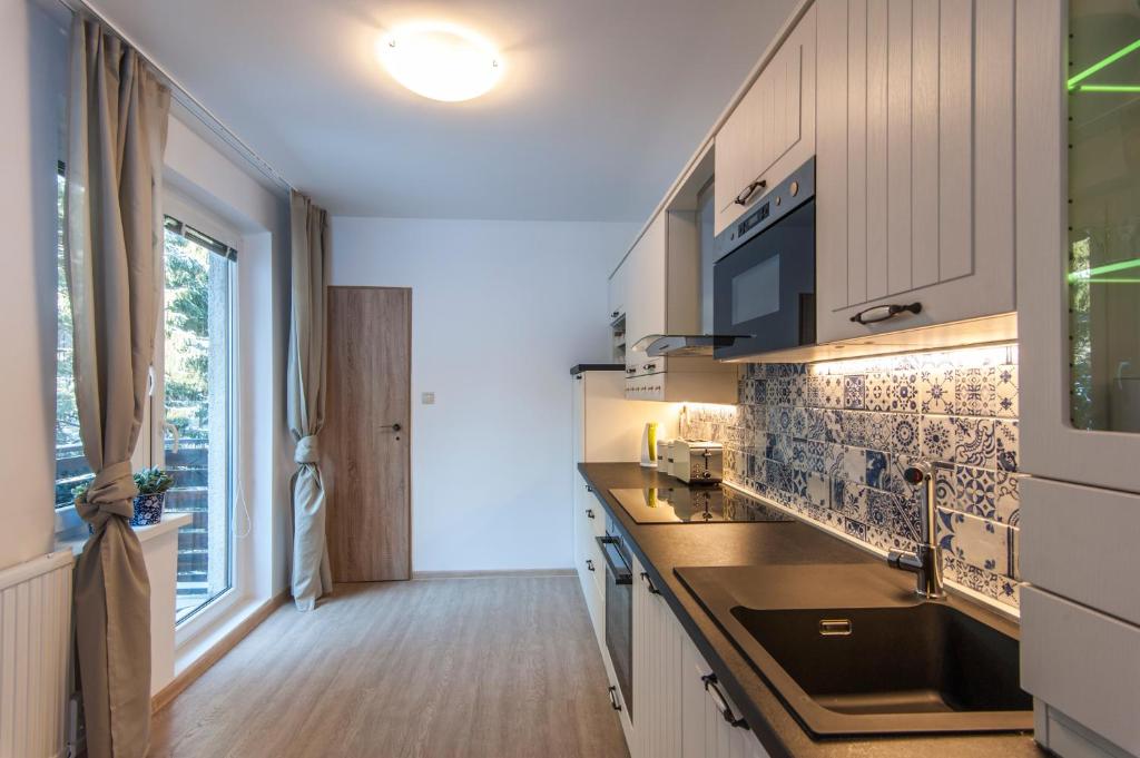 A kitchen or kitchenette at Ski apartmán CHOPOK JASNA