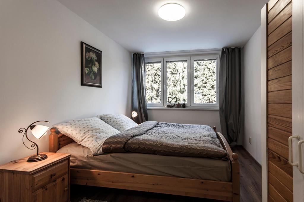 A bed or beds in a room at Ski apartmán CHOPOK JASNA