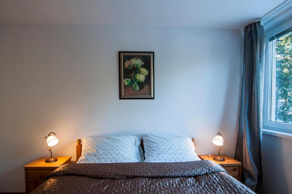 A bed or beds in a room at Ski apartmán CHOPOK JASNA