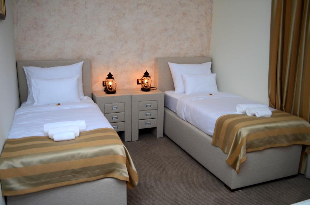 Postel nebo postele na pokoji v ubytování Hotel Helada