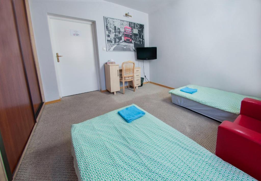 Posteľ alebo postele v izbe v ubytovaní Wilanowska Hostel