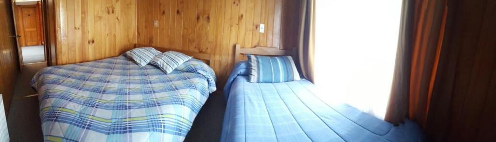 Postel nebo postele na pokoji v ubytování Hostal Costa Azul