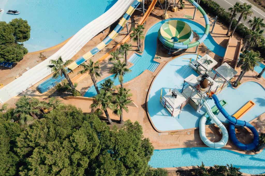 an overhead view of a water park with a water slide at BLUESEA Marina Parc in Na Macaret