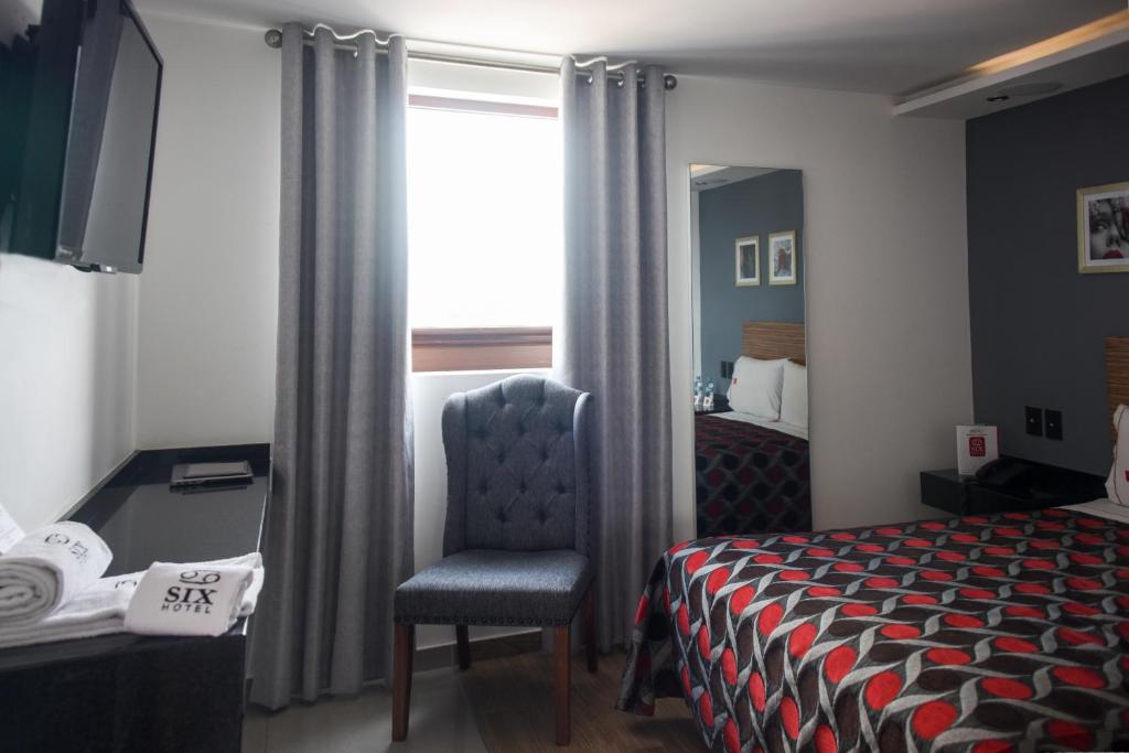 Postel nebo postele na pokoji v ubytování Six Hotel Guadalajara Expiatorio