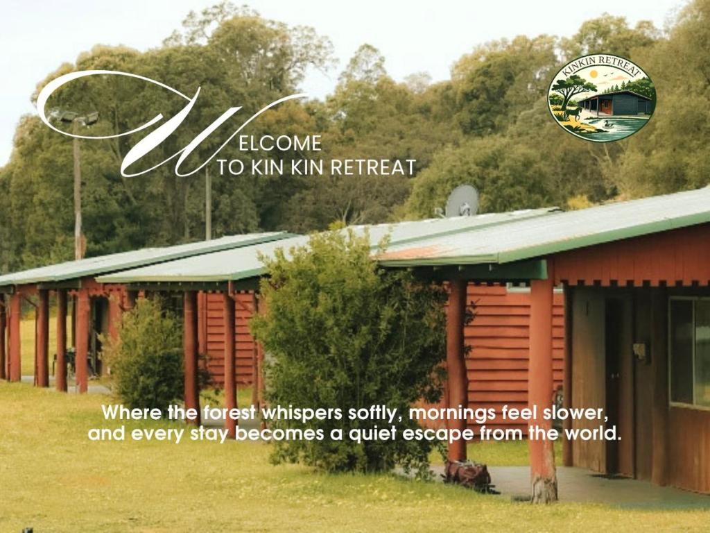 a sign that says welcome to kiwi inn retreat at Kin Kin Retreat in Quinninup