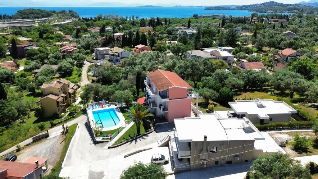 an aerial view of a house with a swimming pool at Thomas Apartments in Dassia