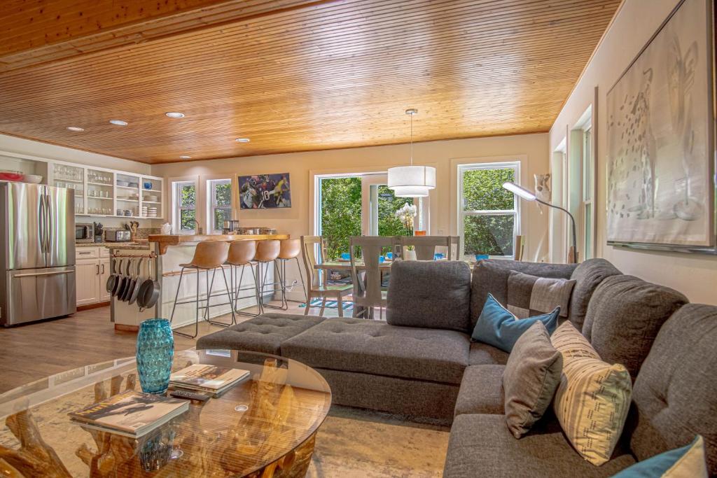 a living room with a couch and a table at Red Elephant | 4BR - Fire Pit - River & Downtown in Hailey