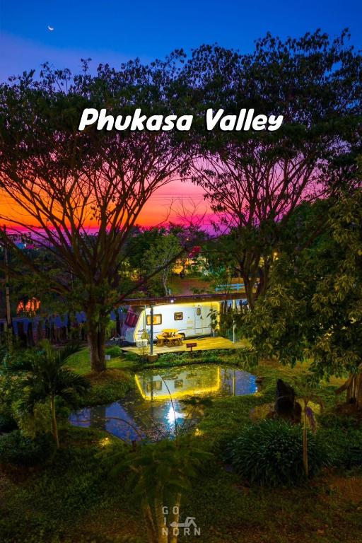 a painting of a sunset in a park with trees at PhuKasa Valley Maesot -Wellness Resort in Ban Mae Kasa