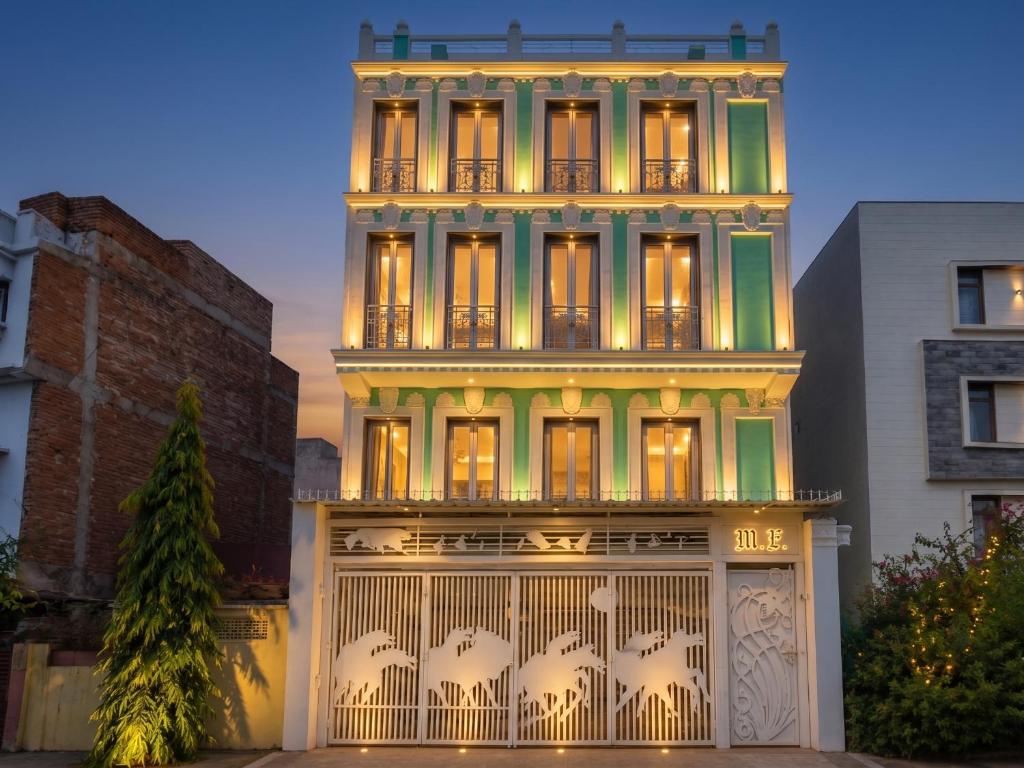 a tall building with a gate in front of it at The Collectors Loft in Jaipur